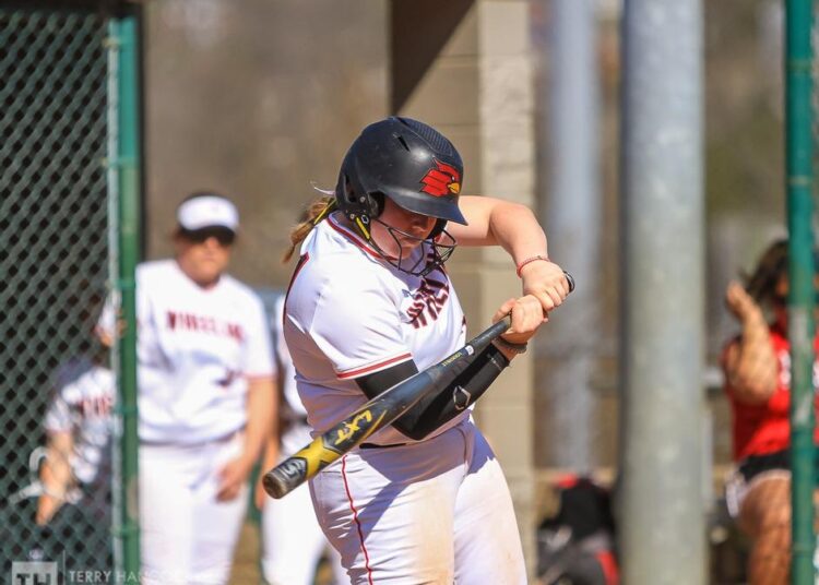 Softball Splits Battle for Wheeling on Big Offensive Day